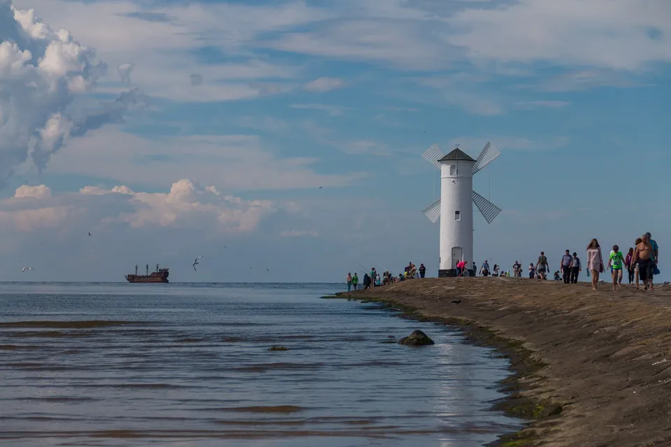 Walking along the breakwater to the beacon
